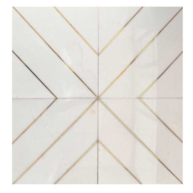 white marble and brass tile