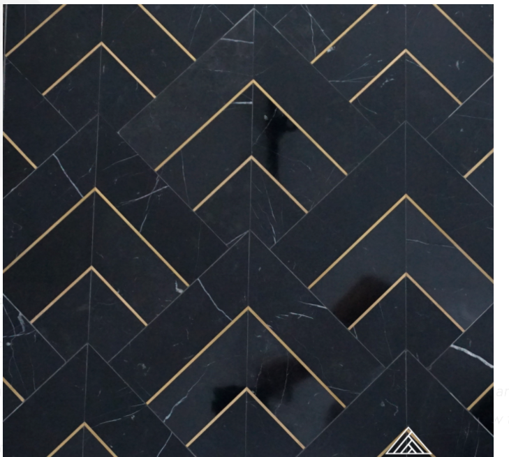 black marble with brass mosaics